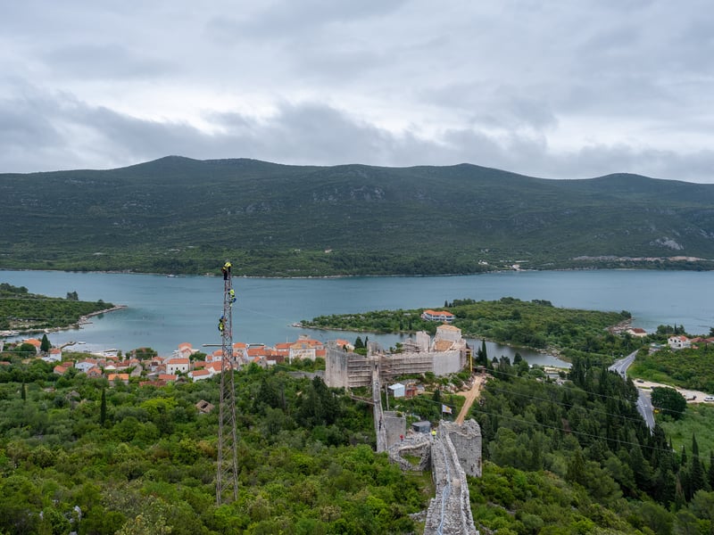 The Walls of Ston climbing the hill above Ston, with Mali Ston and its bay behind